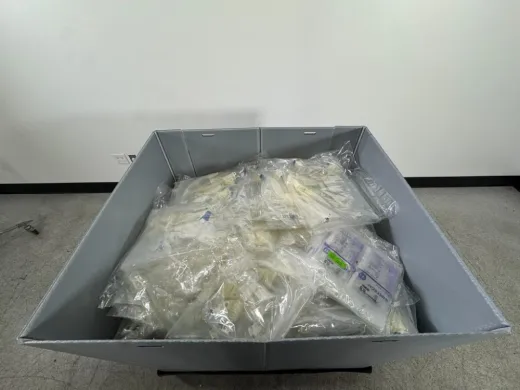 Assorted Laboratory Consumables Including Sterile Gloves and Packaged Tubing Sets