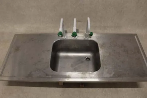 Stainless Steel Countertop with Integrated Sink and Triple Taps