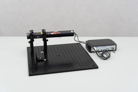 Thorlabs HRS 015 Stabilized HeNe Laser with Power Supply and Optical Aluminum Mounting Plate MB4545/M-cover