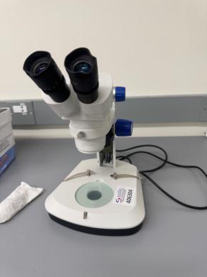Stereo Microscope with Binocular Eyepieces and Adjustable Focus for Laboratory Use-cover